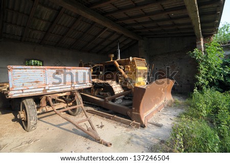 old farm working machine in an abandoned farm in north Italy