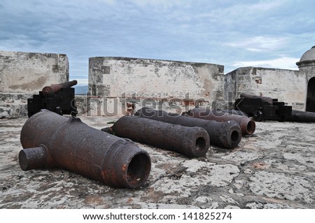 Old Rusty Unused Guns over the Rooftop in Cuba