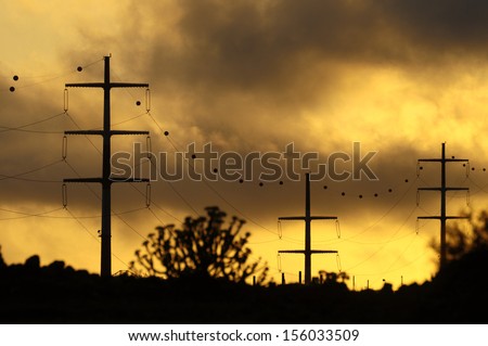 Power Electric Tower on a Cloudy Sky at Sunset