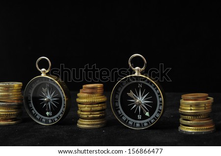 Orientation in  Business Compass and Money on a Black Background