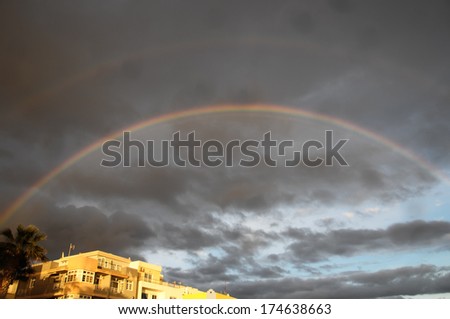 Colored Rainbow over a Cloudy Sky in Tenrife Canary Islands
