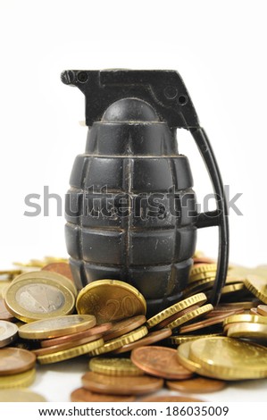 Money for War Concept Hand Grenade and coins