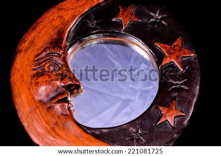 Vintage Wooden Handmade Mirror with Moon and Stars on a Black Background