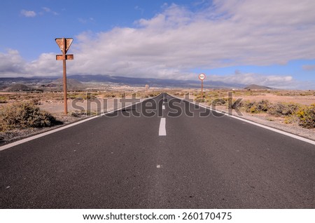 Long Empty Desert Asphalt Road in Canary Islands Spain