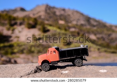 Transportation Concept Old Toy Truck on the Rocks