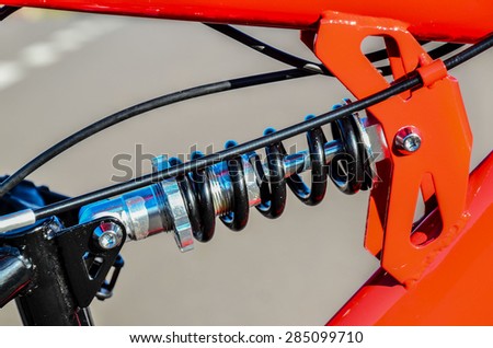 Close up of Modern Red Full Suspension Mountain Bike MTB Bicycle