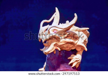 Wood Handmade Statue of a Dragon on Black Background