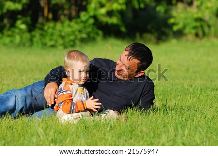 Happy father and the son on the nature