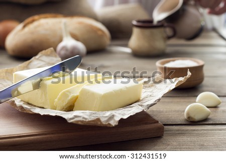 butter knife , bread , garlic and milk , breakfast in the countryside