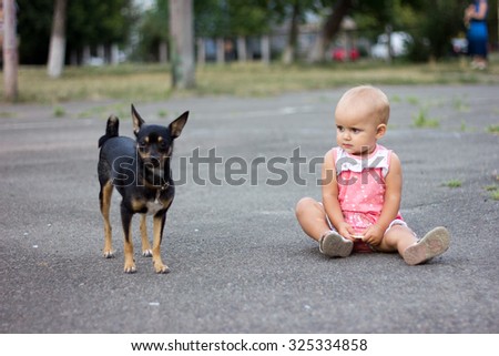 Little girl and little dog