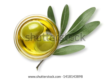 Delicious big green olives in an olive oil with leaves, isolated on white background, view from above ストックフォト © 