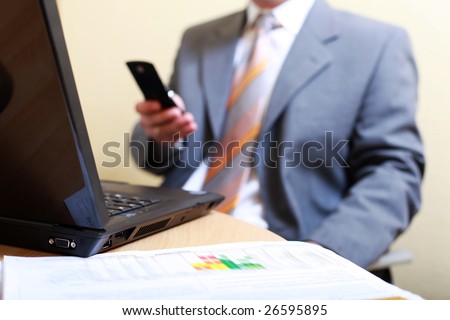 Strictly confidential - Business man with Cell Phone - The chief send text message with new profit and stock result`s to his Sales MAnager and Procurement Team at the wallstreet