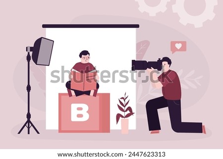 Handsome boy at photo session, photographer uses camera with tele lens and making photos. Smart caucasian kid with book sitting on cube before camera. Photo studio interior with equipment. flat vector