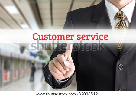 Businessman hand pointing on screen keyboard customer service - can be used for text editing or bring your commercials.