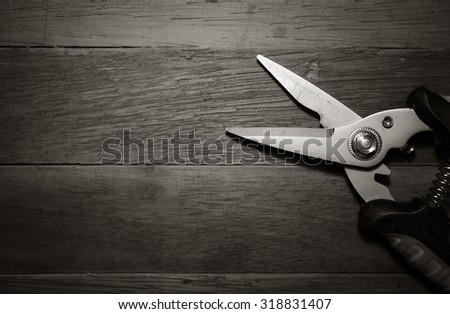 pruning  shears in black and white tone with vignette style, found object image.