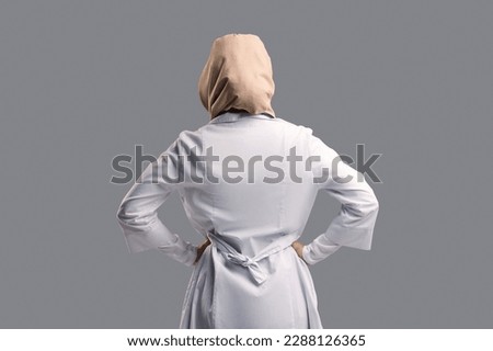 Similar – Image, Stock Photo Female doctor in coveralls holding COVID-19 PCR nasal swabbing kit