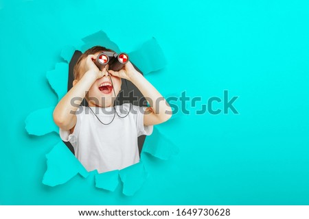 Similar – Image, Stock Photo Child looks through hole in snow