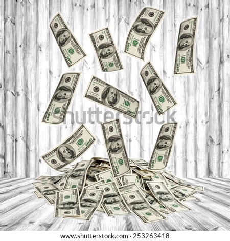 big pile of money. dollars on the wood background