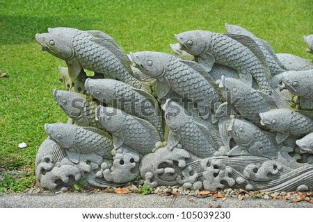 Koi Stone Carving Installation In A Park