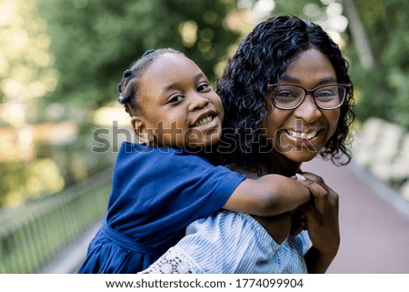 Similar – Image, Stock Photo Mother holding daughter