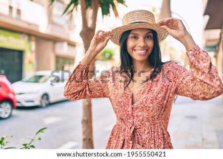 Young african american tourist woman on vacation smiling happy walking at the city.