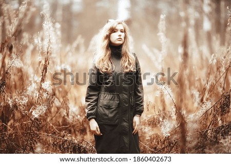 model late autumn in the park, european style adult girl in seasonal glamorous look