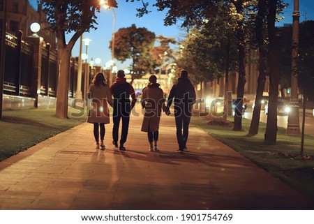 friends group autumn walk city street, night city, party in winter city