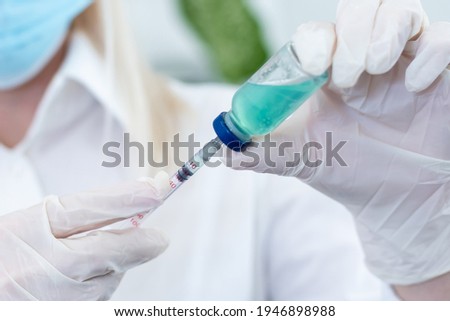 Medical treatment vaccine and syringe for injections. Prevention and treatment of coronary infection. Medicine is an infectious concept.