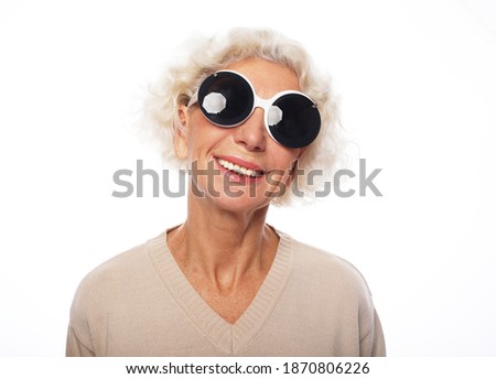 Senior elegance woman wearing big sunglasses isolated on white background