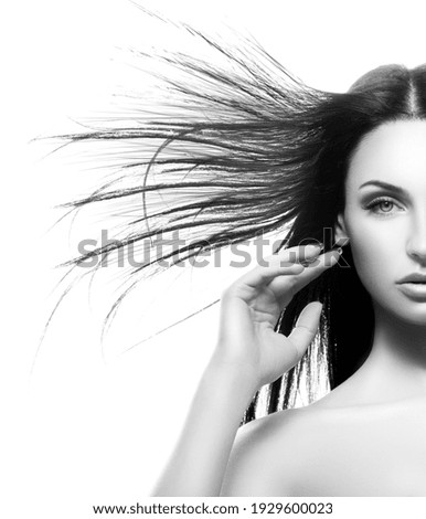 Attractive model woman with hair on wind, perfet skin, isolated on white. Monochrome