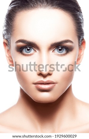 Beauty face of beautiful young adult caucasian fashion model woman with natural lips, make-up, perfect skin, isolated. Studio portrait