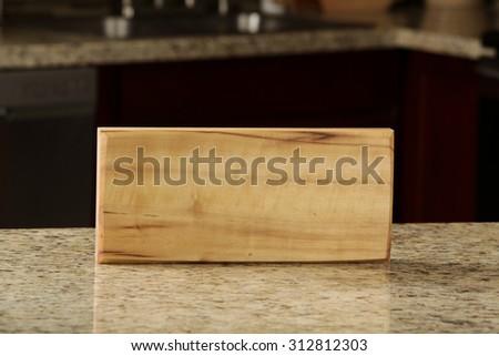 Wood cutting board on display in modern kitchen