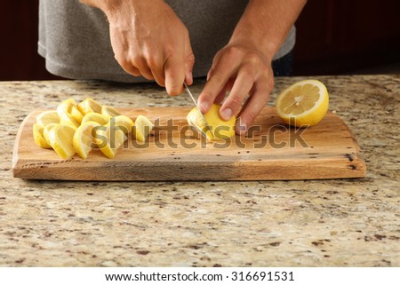 Lemons being cut on a unique cutting board