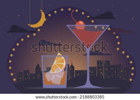 Friday night, cocktail party concept. Alcoholic cocktails old fashioned and manhattan, backdrop of night big city, lights, skyscrapers and sky. Relax in the bar, festive atmosphere