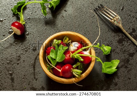 Concept of vegan food - radishes with water drops, selective focus