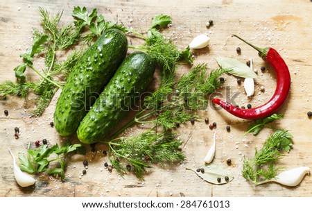 Preparing pickled cucumbers with spices and herbs, top view, selective focus