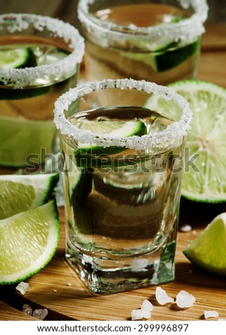 Silver Mexican tequila with lime and salt, selective focus