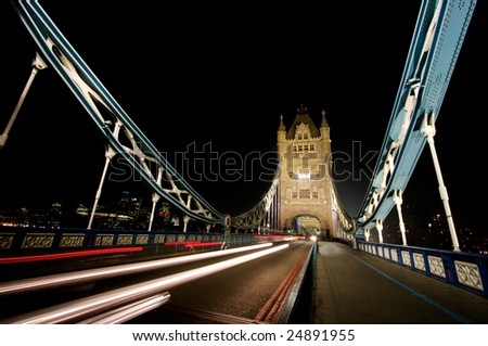 Light trails at night across Tower Bridge, London