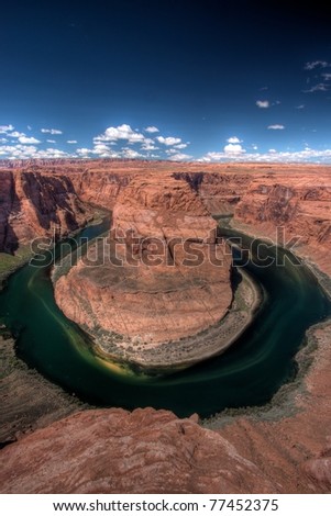 Horseshoe Bend, near Page, Arizona, USA. A dramatic meander of the Colorado river south of Glen Canyon Dam. High dynamic range image made of three blended exposures