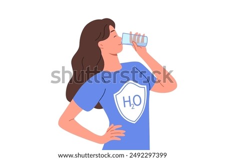 Woman drinks water from glass, dressed in t-shirt with h2o logo, uses aqua therapy to cleanse of toxins. Girl enjoys taste of purified mineral water obtained in environmentally friendly place