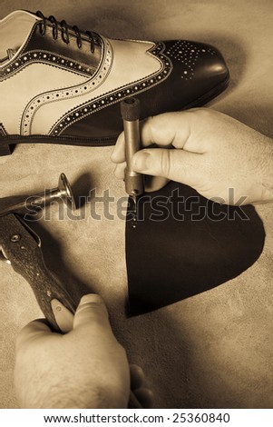 Professional shoes worker finished job on the retro shoes on the skin