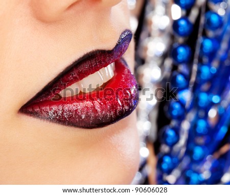Glamour Red gloss lips moving up on bright blue background, shallow focus