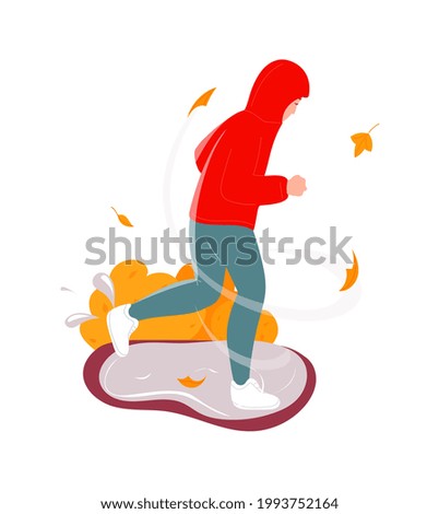 Man running under falling autumn leaves, bad windy weather