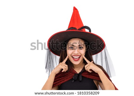 Asian woman wearing Halloween costume as witch in red cloak, on white background, closeup face, looking at camera