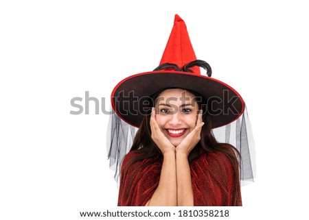 Asian woman wearing Halloween costume as witch in red cloak, on white background, closeup face, looking at camera