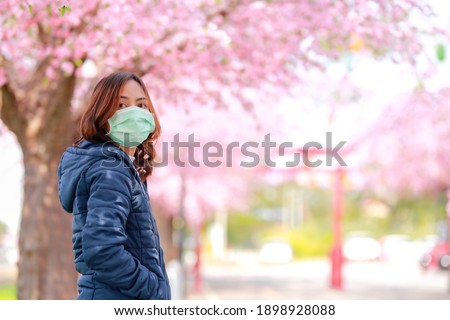 Corona virus in Japan portrait of a traveler young asian woman wearing surgical mask to protect from Corona virus(COVID-19). concept tourists travel in asia after the coronavirus epidemic.