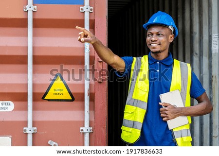 Seaport inspector busy with in-checking on cargo and pointing to position loading Containers box from Cargo freight ship at Cargo container shipping on a large commercial shipping dock Zdjęcia stock © 