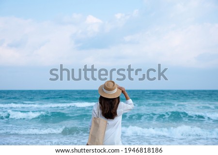 Similar – Image, Stock Photo Woman in hat standing on beach and enjoying seascape