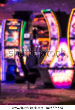 Defocused casino slot machine blur with colorful lights