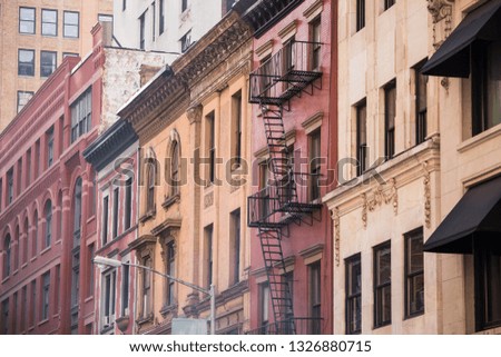 Cityscape of colorful vintage apartment buildings in a row in New York City Manhattan